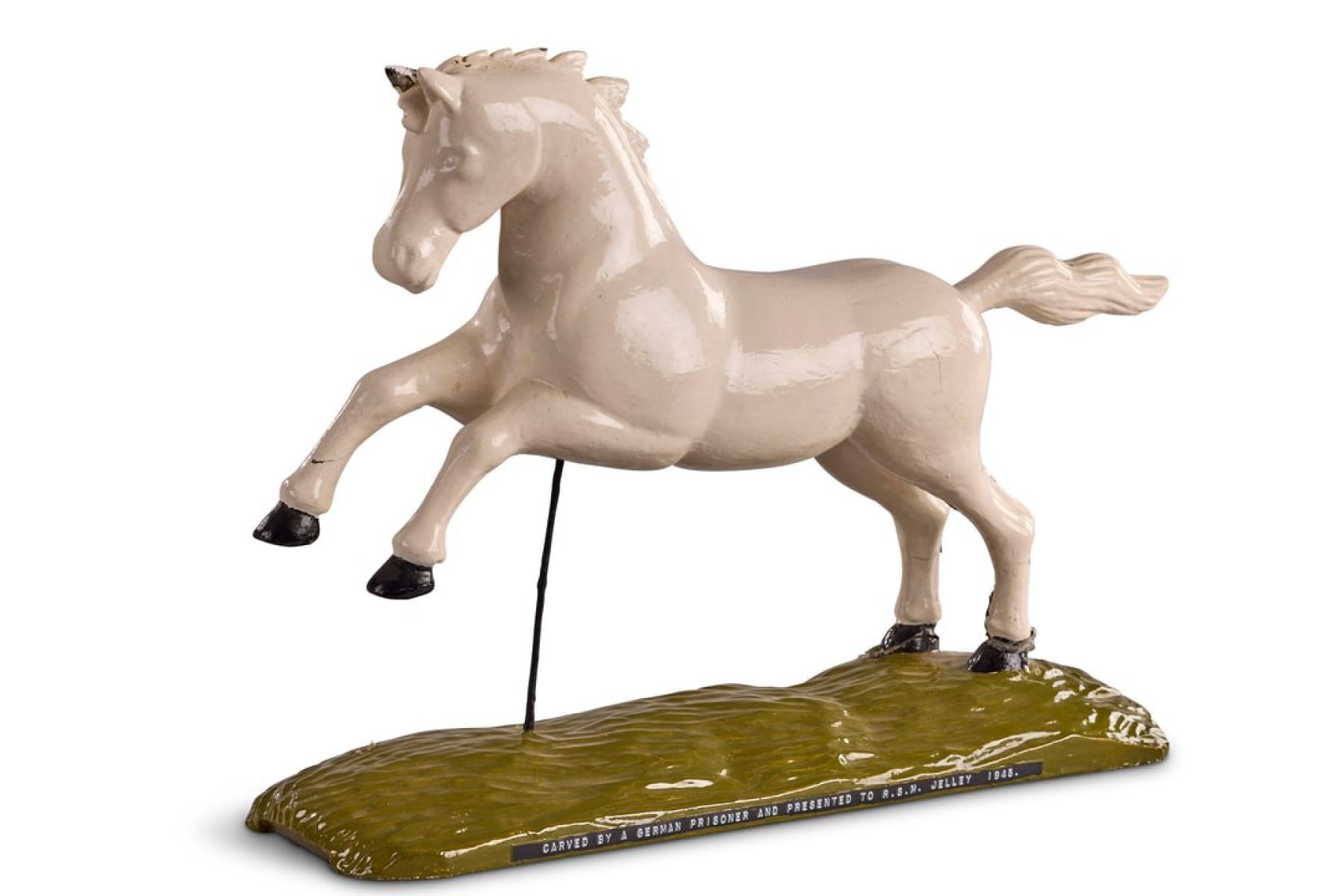 Wooden model of the Northamptonshire Yeomanry badge depicting a white horse.