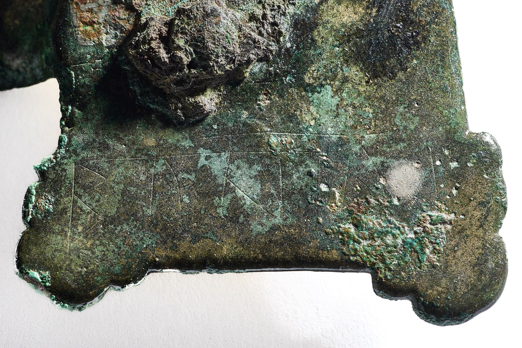 Rear of the Wakerley brooch showing the scratched runes, possibly a female name