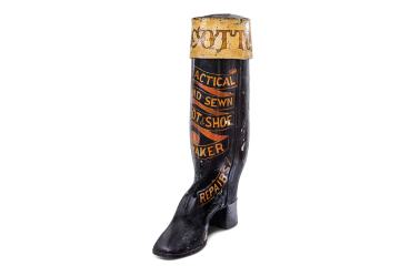 Large painted wood and lead boot advertsing Cottons, boot and shoe manufacturers and retailsers in Oundle.