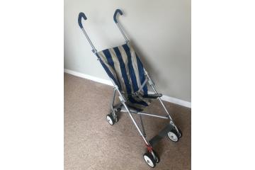 Maclaren Baby buggy with blue and white striped seat