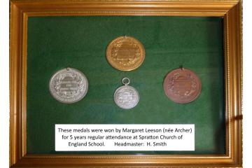 4 Spratton School Attendance medals in wooden frame
