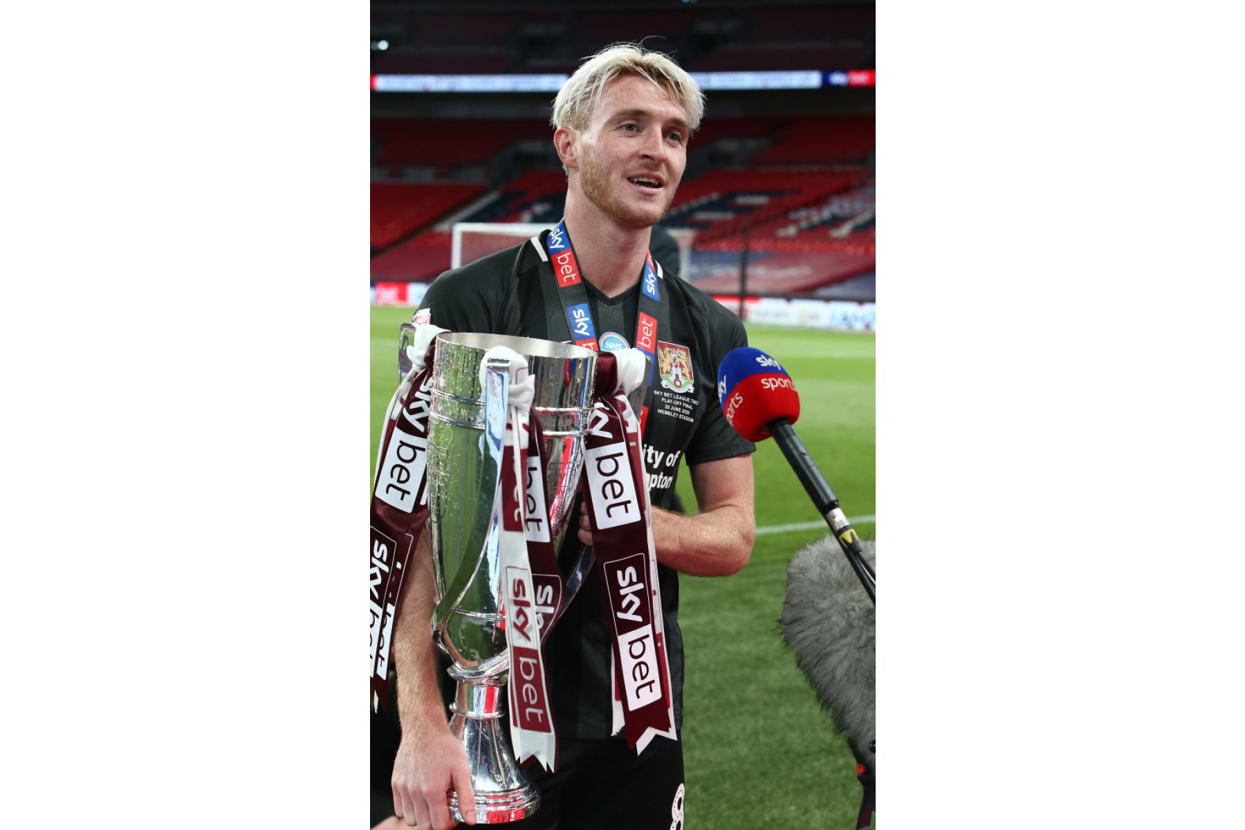 Ryan Watson with League 2 Play off trophy 2020