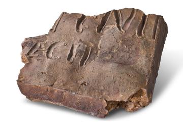 Roman pottery tile marked with maker's name