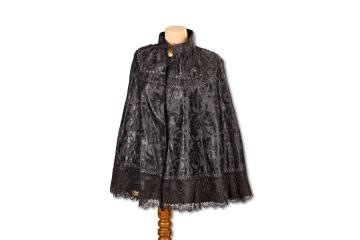 Decorated black women's cape handmade by the wife of the Eydon village tailor
