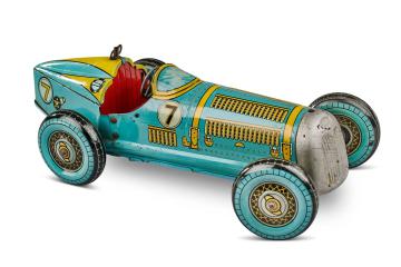 Large tin plate windup toy car produced by Mettoy in 1950s