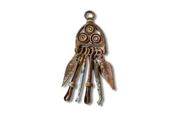 Bronze, enamelled Roman vanity set hung from a chatelaine